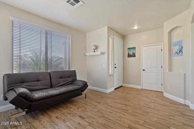 384 N Scott Dr, Chandler, AZ 85225 - living area featuring baseboards, light wood finished floors, and visible vents