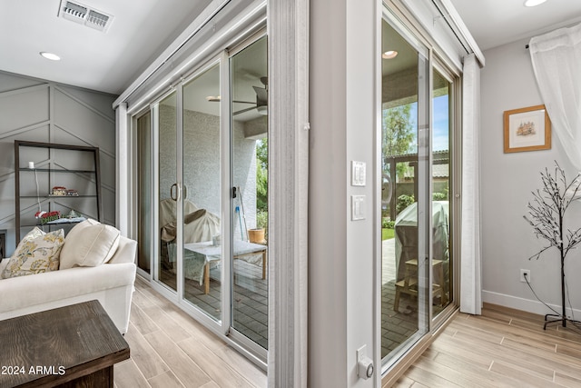 doorway to outside featuring light wood-type flooring and plenty of natural light