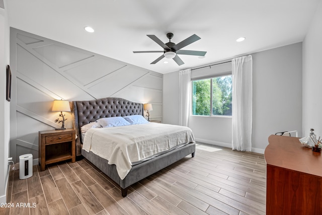 bedroom featuring ceiling fan and hardwood / wood-style floors