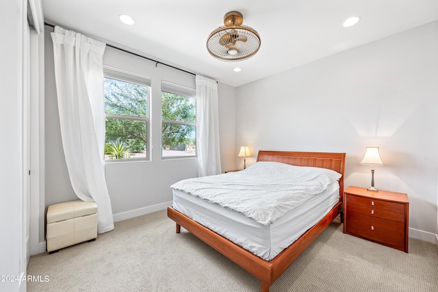 bedroom with light colored carpet