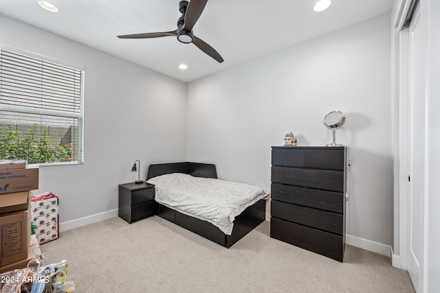 carpeted bedroom featuring ceiling fan