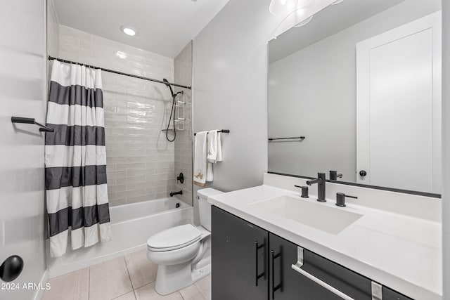 full bathroom featuring vanity, shower / tub combo, tile patterned flooring, and toilet