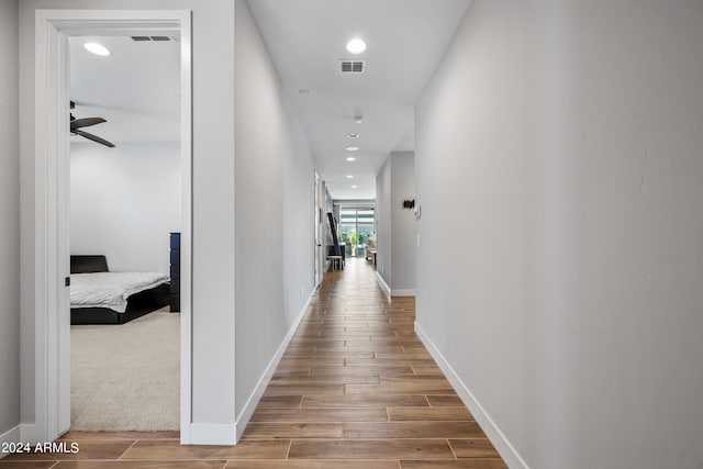 corridor featuring carpet floors