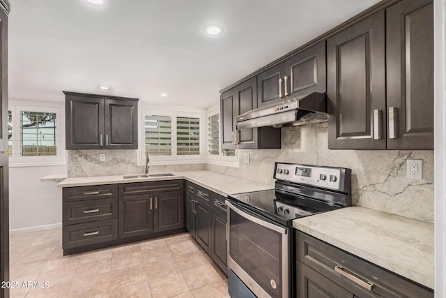 10244 N 65th Ln, Glendale, AZ 85302 - kitchen featuring stainless steel range with electric stovetop, a sink, under cabinet range hood, backsplash, and light countertops