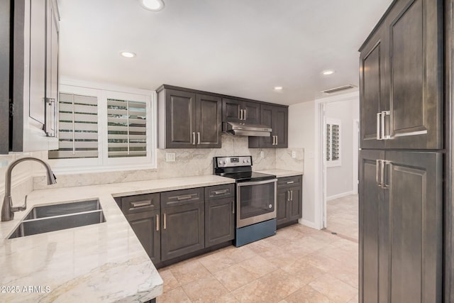 10244 N 65th Ln, Glendale, AZ 85302 - kitchen featuring electric range, a sink, under cabinet range hood, dark brown cabinetry, and decorative backsplash