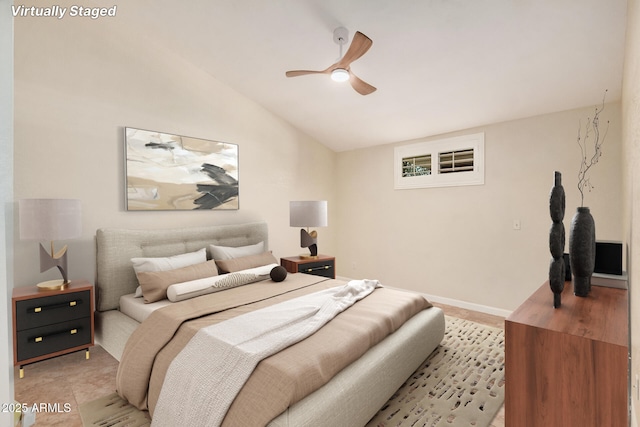 10244 N 65th Ln, Glendale, AZ 85302 - bedroom with vaulted ceiling, a ceiling fan, and baseboards
