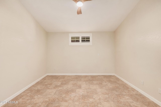 10244 N 65th Ln, Glendale, AZ 85302 - empty room featuring a ceiling fan, baseboards, and stone finish flooring