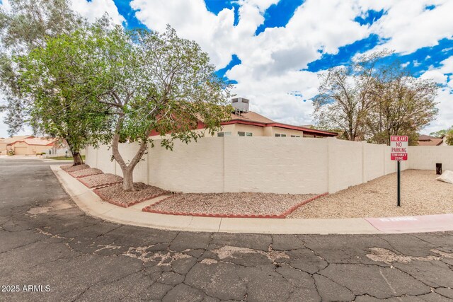 10244 N 65th Ln, Glendale, AZ 85302 - view of side of home with fence and stucco siding