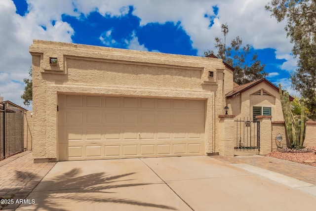 10244 N 65th Ln, Glendale, AZ 85302 - southwest-style home with concrete driveway, a gate, a garage, stucco siding, and fence