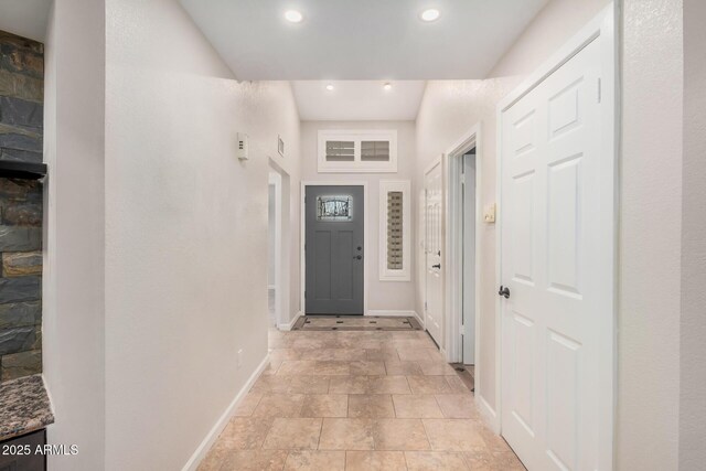 10244 N 65th Ln, Glendale, AZ 85302 - entryway with baseboards, recessed lighting, and light stone finish flooring