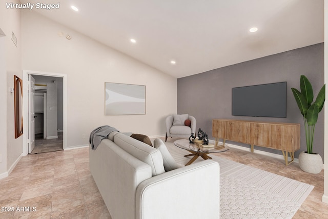 10244 N 65th Ln, Glendale, AZ 85302 - living area featuring vaulted ceiling, recessed lighting, and baseboards