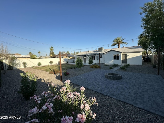 1930 W Missouri Ave, Phoenix, AZ 85015 - back of property with a patio, a fenced backyard, and an outdoor fire pit
