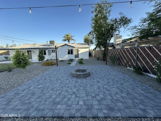 1930 W Missouri Ave, Phoenix, AZ 85015 - view of front of home with a fenced backyard, a fire pit, and a patio