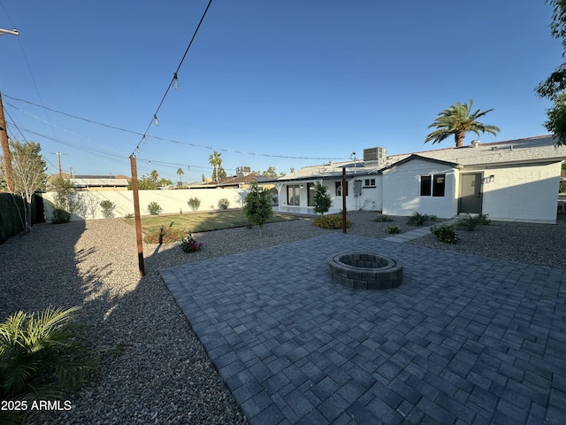 1930 W Missouri Ave, Phoenix, AZ 85015 - view of front of property with a patio, a fenced backyard, and an outdoor fire pit