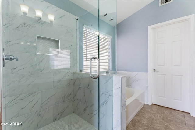 1520 E Flint St, Chandler, AZ 85225 - full bathroom with lofted ceiling, visible vents, a bath, a shower stall, and tile patterned floors