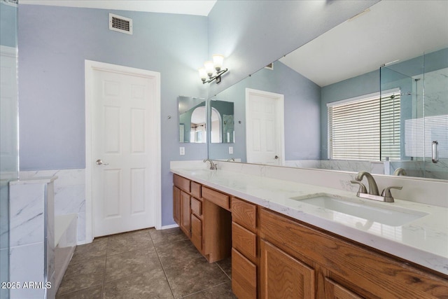 1520 E Flint St, Chandler, AZ 85225 - full bath with plenty of natural light, vaulted ceiling, visible vents, and a sink