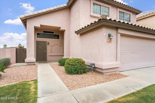 1520 E Flint St, Chandler, AZ 85225 - mediterranean / spanish house with a tile roof, fence, an attached garage, and stucco siding
