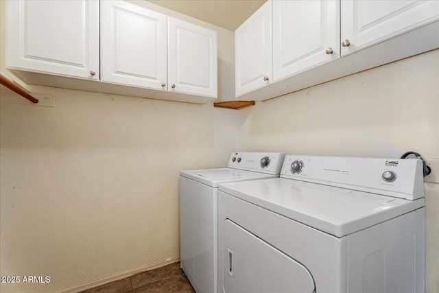 1520 E Flint St, Chandler, AZ 85225 - laundry room with cabinet space, washing machine and clothes dryer, dark tile patterned flooring, and baseboards