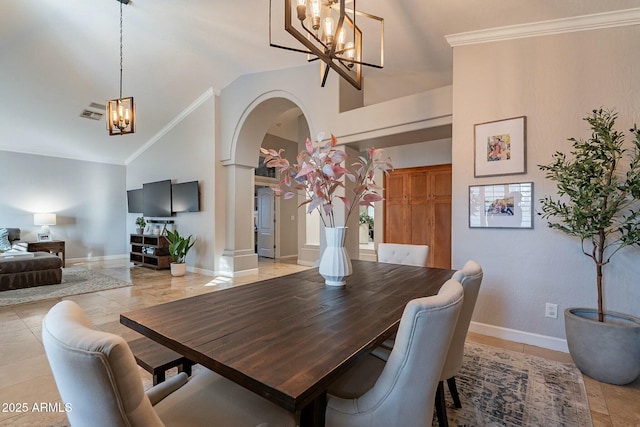 tiled dining space featuring crown molding, a chandelier, and high vaulted ceiling