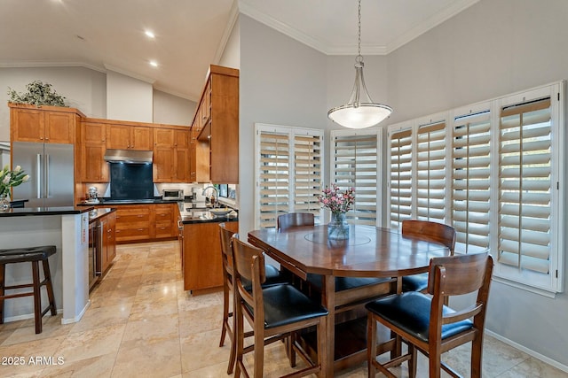 dining area featuring ornamental molding, sink, wine cooler, and high vaulted ceiling