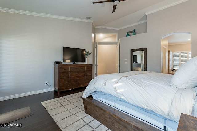 bedroom featuring ceiling fan, ornamental molding, dark hardwood / wood-style floors, and lofted ceiling