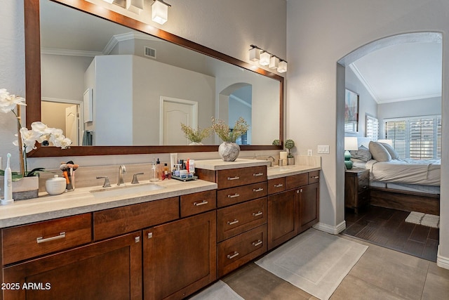 bathroom with vanity, tile patterned flooring, and ornamental molding