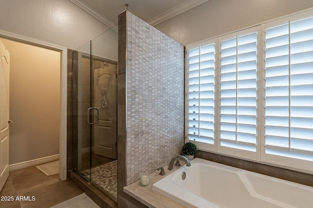 bathroom with independent shower and bath, ornamental molding, and tile patterned flooring