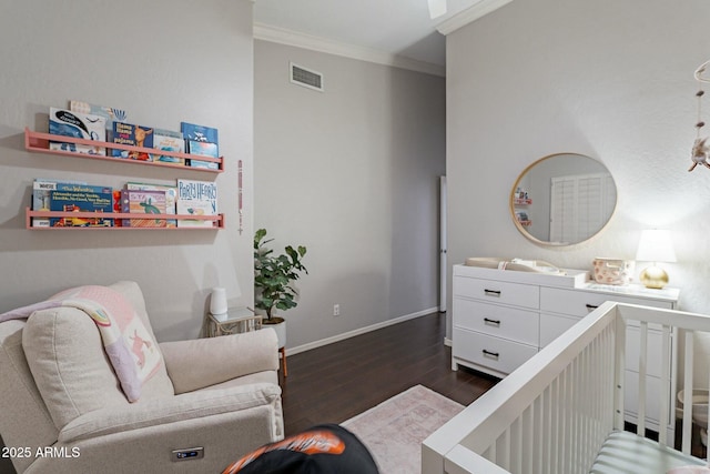 bedroom featuring crown molding and dark hardwood / wood-style flooring