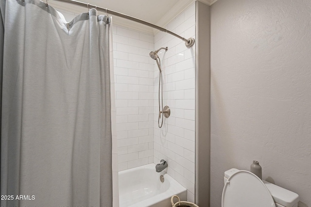 bathroom with shower / bath combination with curtain and toilet