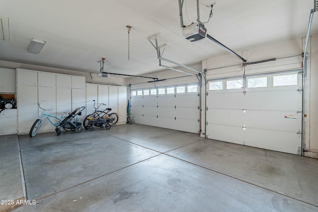 garage featuring a garage door opener