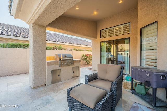 view of patio featuring area for grilling and an outdoor kitchen