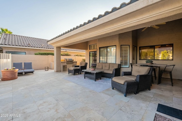 view of patio / terrace with area for grilling, an outdoor living space, and ceiling fan