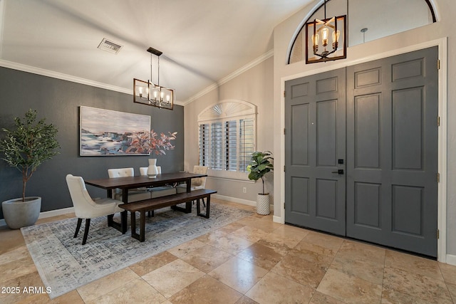 entrance foyer featuring a notable chandelier and crown molding