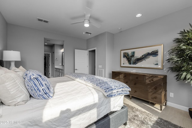 tiled bedroom with ensuite bathroom, ceiling fan, and a closet