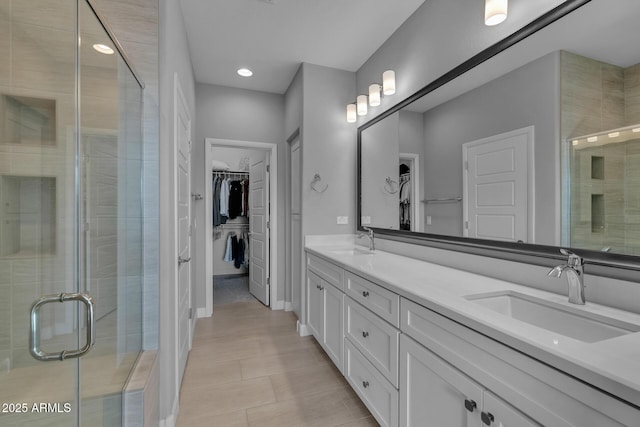 bathroom featuring vanity and walk in shower