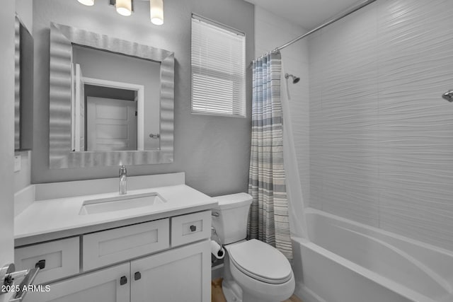 full bathroom featuring vanity, toilet, and shower / tub combo