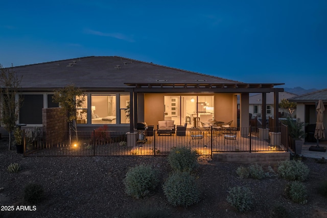 back of property featuring outdoor lounge area and a patio