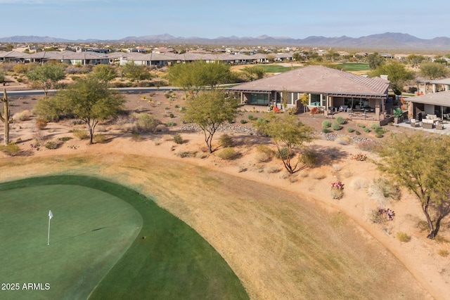 birds eye view of property with a mountain view