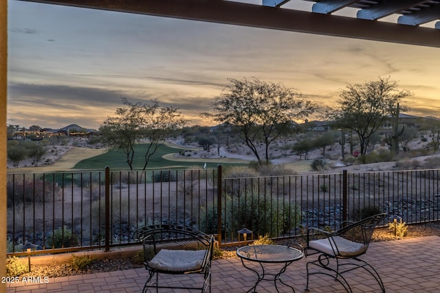 view of patio terrace at dusk