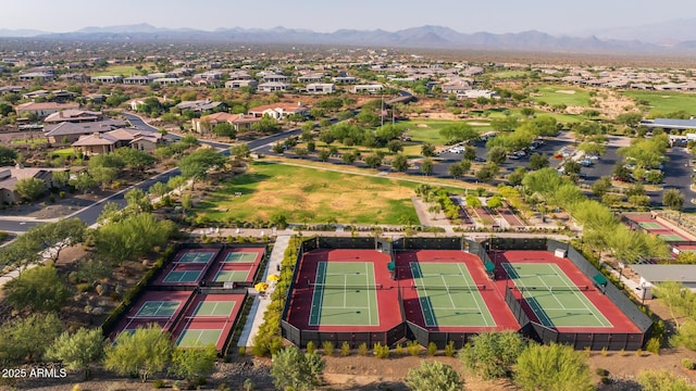 birds eye view of property with a mountain view