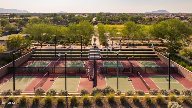 view of tennis court featuring a mountain view