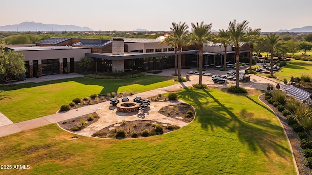 birds eye view of property with a mountain view