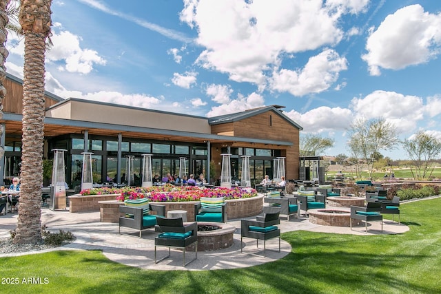 exterior space featuring a yard and a fire pit