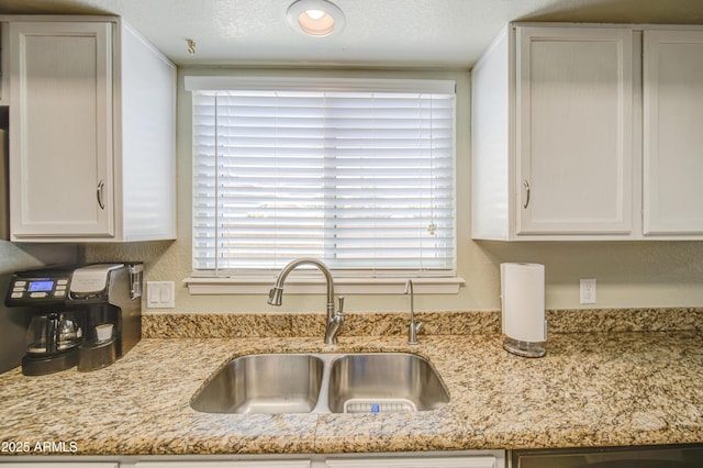 5424 E Florian Ave, Mesa, AZ 85206 - kitchen featuring a sink, white cabinets, and light stone countertops