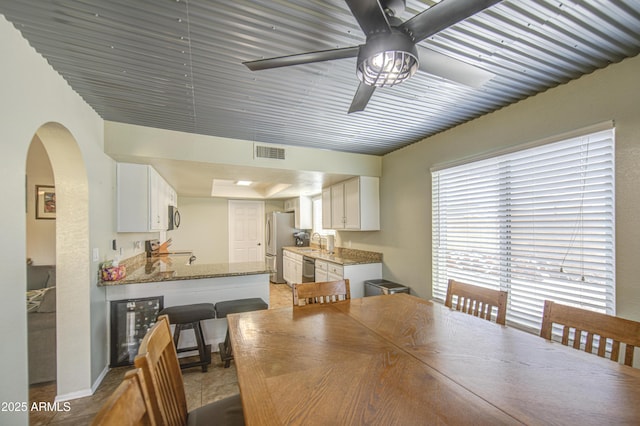 5424 E Florian Ave, Mesa, AZ 85206 - dining area with a ceiling fan and arched walkways