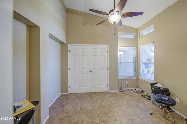 5424 E Florian Ave, Mesa, AZ 85206 - unfurnished bedroom featuring high vaulted ceiling, a closet, a ceiling fan, and baseboards