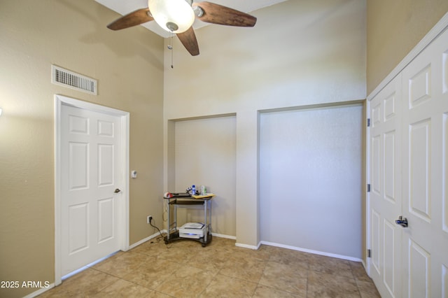 5424 E Florian Ave, Mesa, AZ 85206 - unfurnished bedroom with a high ceiling, ceiling fan, and light tile patterned floors