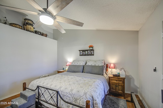 5424 E Florian Ave, Mesa, AZ 85206 - bedroom with wood finished floors, baseboards, ceiling fan, and a textured ceiling