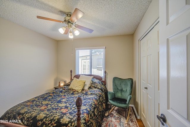 5424 E Florian Ave, Mesa, AZ 85206 - bedroom featuring a textured ceiling, wood finished floors, ceiling fan, and a closet