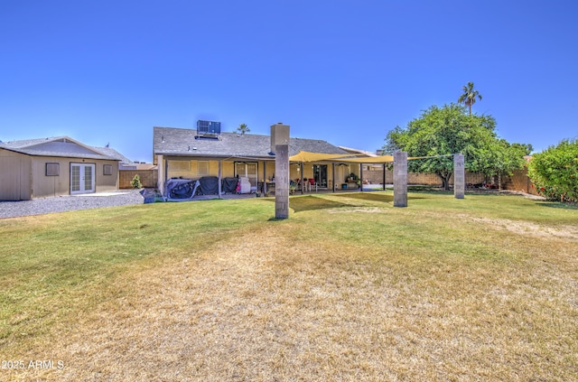 5424 E Florian Ave, Mesa, AZ 85206 - back of house featuring french doors, central AC unit, a patio area, and a chimney